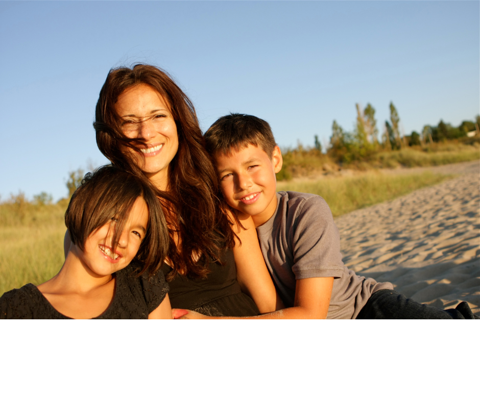 Mom with two children in an outdoor setting